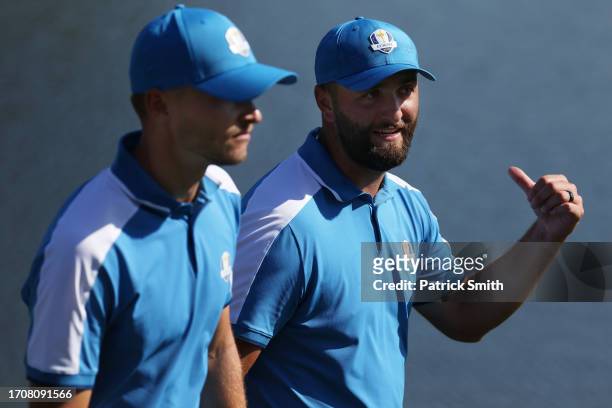 Nicolai Hojgaard and Jon Rahm of Team Europe walk from the eighth green during the Friday afternoon fourball matches of the 2023 Ryder Cup at Marco...