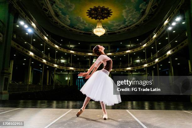 young ballerina rehearsing on a stage theater - representação teatral imagens e fotografias de stock