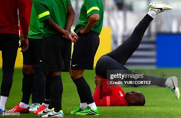 Brazil's goalkeeper Jefferson stretches during a training session in Fortaleza, northeastern Brazil, on the eve of their FIFA Confederations Cup...