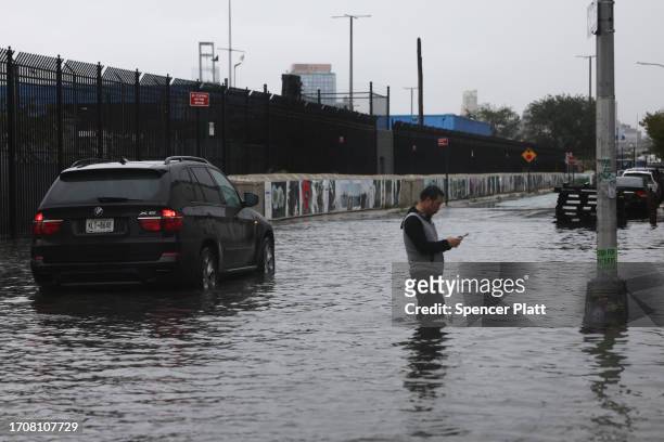 Cars sit stuck in the flooded streets in the Red Hook neighborhood on September 29, 2023 in the Brooklyn borough of New York City. Much of the...