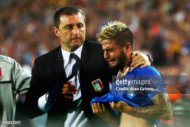 Head coach Devis Mangia of Italy comforts Lorenzo Insigne after losing their UEFA European U21 Championship final match against Spain at Teddy...
