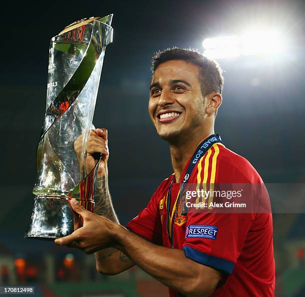 Thiago Alcantara of Spain poses with the trophy after winning the UEFA European U21 Championship final match against Italy at Teddy Stadium on June...