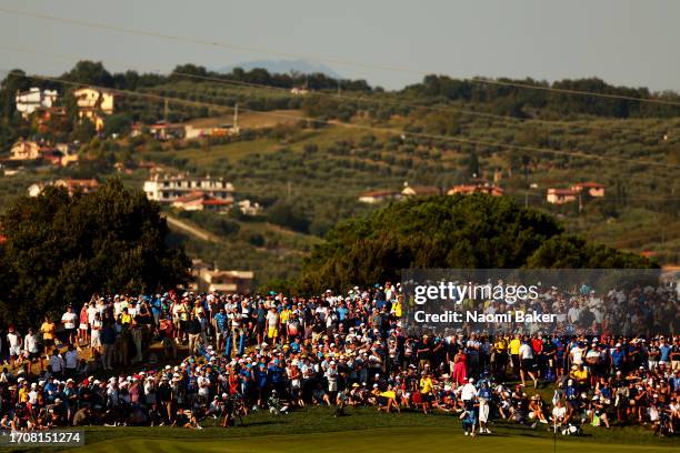 Robert MacIntyre of Team Europe lines up a putt on the 12th green during the Friday afternoon fourball matches of the 2023 Ryder Cup at Marco Simone...