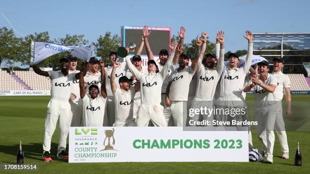 The Surrey players celebrate with the LV= Insurance County Championship Division 1 Trophy after the LV= Insurance County Championship Division 1...