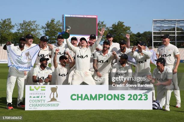 The Surrey players celebrate with the LV= Insurance County Championship Division 1 Trophy after the LV= Insurance County Championship Division 1...