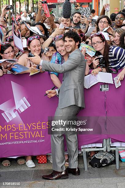 Darren Criss poses with fans during the 'Imogene' Paris Premiere as part of The Champs Elysees Film Festival 2013 at Publicis Champs Elysees on June...