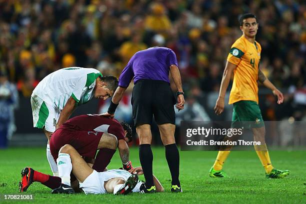 Ali Bahjat Fadhil of Iraq lays on the ground during the FIFA 2014 World Cup Asian Qualifier match between the Australian Socceroos and Iraq at ANZ...