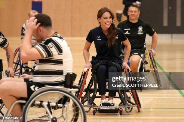 Britain's Catherine, Princess of Wales, tries wheelchair rugby as she joins a training session facilitated by members of the World Cup-winning...