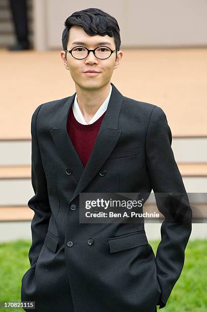 Khalil Fong arrives for the Burberry Prorsum show at the London Collections: MEN SS14 at Kensington Gardens on June 18, 2013 in London, England.
