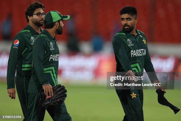 Babar Azzam of Pakistan talks to Mohammad Rizwan at the end of the ICC Men's Cricket World Cup India 2023 warm up match between New Zealand and...