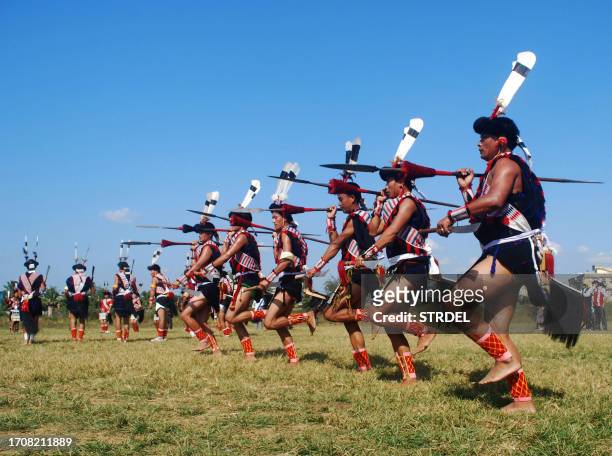 Naga tribesman perform a traditional folk dance during the Tokhu Emong, a post harvest festival of the Lotha tribe in Dimapur, India's northeastern...