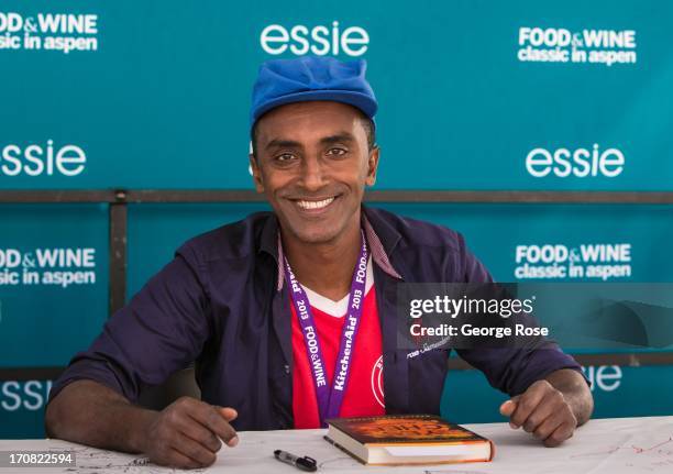 Celebrity chef Marcus Samuelsson signs copies of his book "Yes, Chef" on June 14 in Aspen, Colorado. The 31st Annual Food & Wine Classic brings...