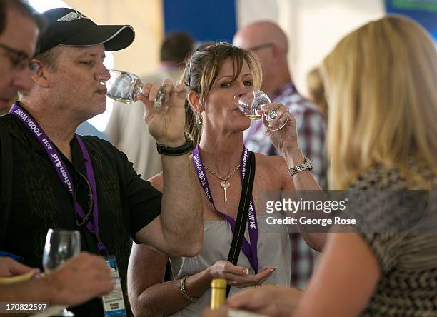 Group of friends sample a taste of wine during the Aspen Food & Wine Classic Grand Tastings on June 14 in Aspen, Colorado. The 31st Annual Food &...
