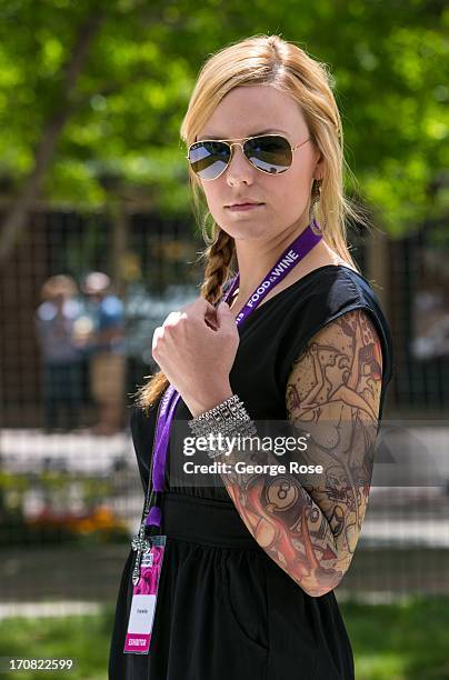 Woman displays her arm tattoos during the Aspen Food & Wine Classic Grand Tasting on June 14 in Aspen, Colorado. The 31st Annual Food & Wine Classic...