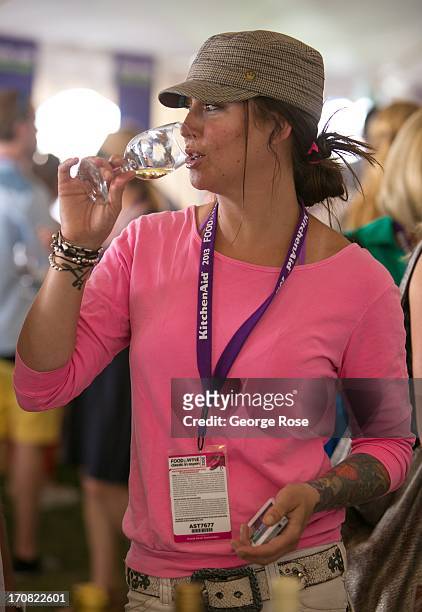 Woman samples a taste of wine during the Aspen Food & Wine Classic Grand Tastings on June 14 in Aspen, Colorado. The 31st Annual Food & Wine Classic...