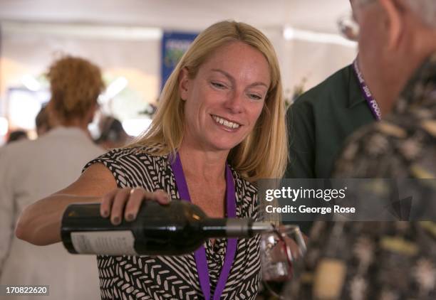 Woman representing Sonoma County wines pours a taste during the Aspen Food & Wine Classic Grand Tasting on June 14 in Aspen, Colorado. The 31st...