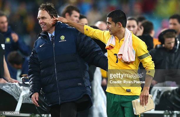 Holger Osieck, head coach of the Socceroos and Tim Cahill of the Socceroos celebrate after the FIFA 2014 World Cup Asian Qualifier match between the...