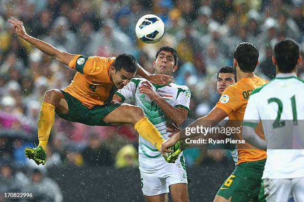 Tim Cahill of the Socceroos heads the ball during the FIFA 2014 World Cup Asian Qualifier match between the Australian Socceroos and Iraq at ANZ...