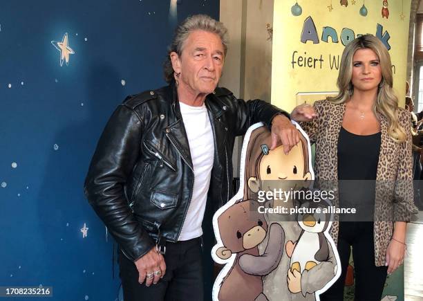 October 2023, Berlin: Peter Maffay and his wife Hendrikje Balsmeyer stand together at the presentation of the third part of their book series...
