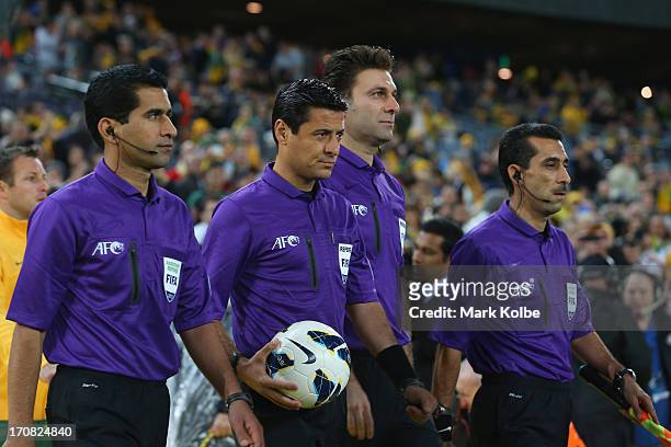 The match officials take to the field during the FIFA 2014 World Cup Asian Qualifier match between the Australian Socceroos and Iraq at ANZ Stadium...
