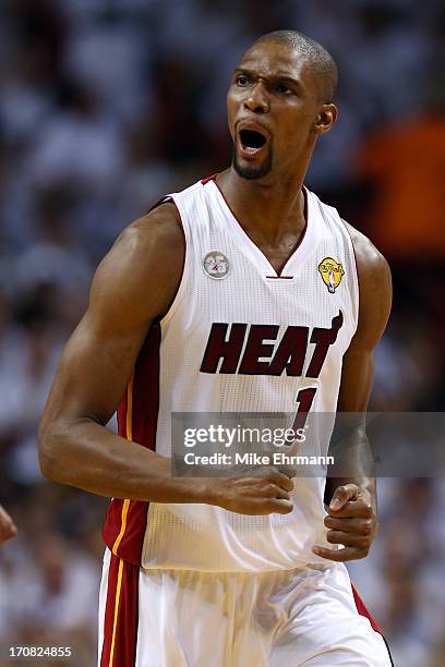 Chris Bosh of the Miami Heat reacts after making a basket in the first quarter while taking on the San Antonio Spurs during Game Six of the 2013 NBA...