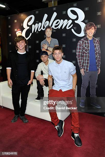 Keaton Stromberg, Wesley Stromberg and Drew Chadwick of Emblem3 appear at the Live Nation merchandise booth at Licensing Expo 2013 at the Mandalay...