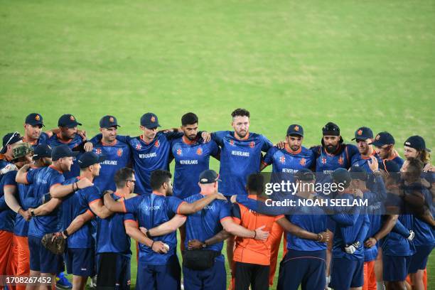 Netherlands' players attend a practice session on the eve of their 2023 ICC men's cricket World Cup one-day international match against Pakistan at...