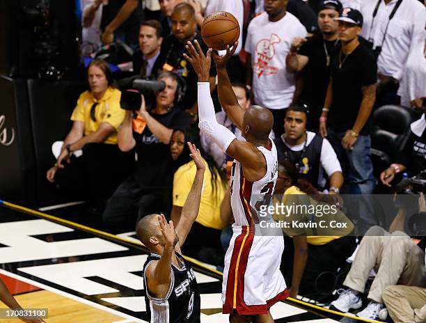 Ray Allen of the Miami Heat makes a game-tying three-pointer over Tony Parker of the San Antonio Spurs in the fourth quarter during Game Six of the...