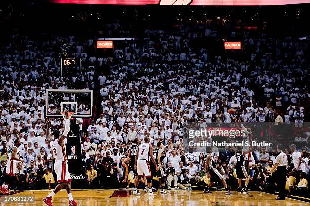 Ray Allen of the Miami Heat hits a three-point shot to tie the score and send the San Antonio Spurs into overtime in Game Six of the 2013 NBA Finals...