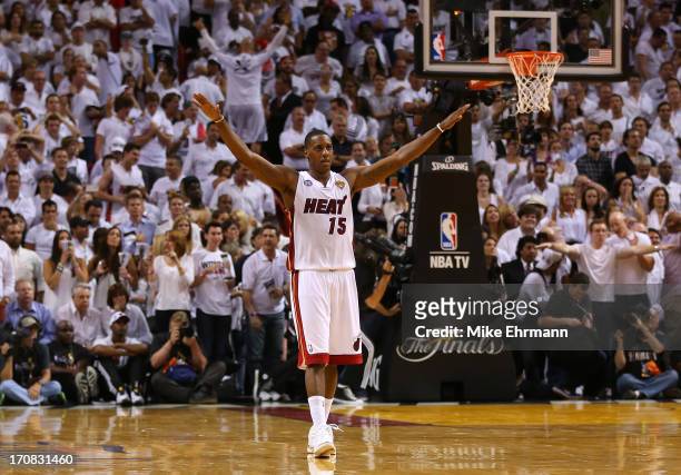 Mario Chalmers of the Miami Heat reacts in overtime against the San Antonio Spurs during Game Six of the 2013 NBA Finals at AmericanAirlines Arena on...