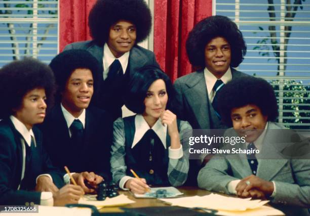 Members of the Jackson 5, with Cher perform in a comedy skit on an episode of the television variety show 'Cher,' New York, New York, March 16, 1975....