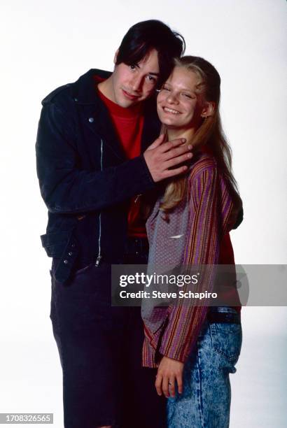 Publicity portrait of Canadian actor Keanu Reeves and American actress Martha Plimpton as they pose against a white background for their film...