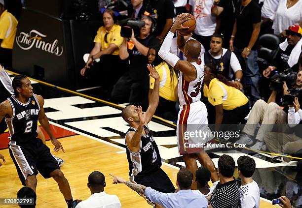 Ray Allen of the Miami Heat makes a game-tying three-pointer over Tony Parker of the San Antonio Spurs in the fourth quarter during Game Six of the...