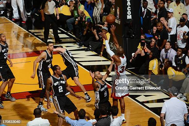 Ray Allen of the Miami Heat hits the game tying three pointer against Tony Parker of the San Antonio Spurs during Game Six of the 2013 NBA Finals on...