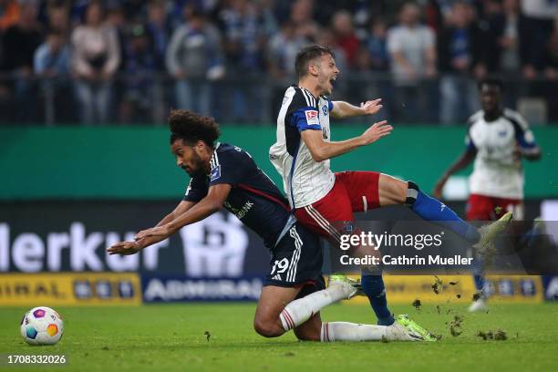 Laszlo Benes of Hamburger SV battles for the ball with Emmanuel Iyoha of Fortuna Dusseldorf during the Second Bundesliga match between Hamburger SV...