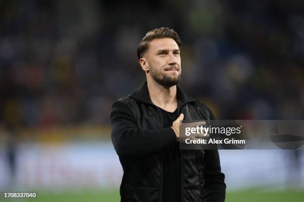 Ermin Bicakcic of TSG Hoffenheim is presented shirt during the Bundesliga match between TSG Hoffenheim and Borussia Dortmund at PreZero-Arena on...