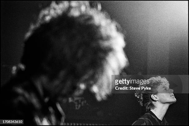 Scottish alternative rock band The Cocteau Twins, live in London July 1988. Left to right: guitarist Robin Guthrie. Singer Elizabeth Fraser
