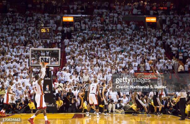 Ray Allen of the Miami Heat hits a three-point shot to tie the score and send the San Antonio Spurs into overtime in Game Six of the 2013 NBA Finals...