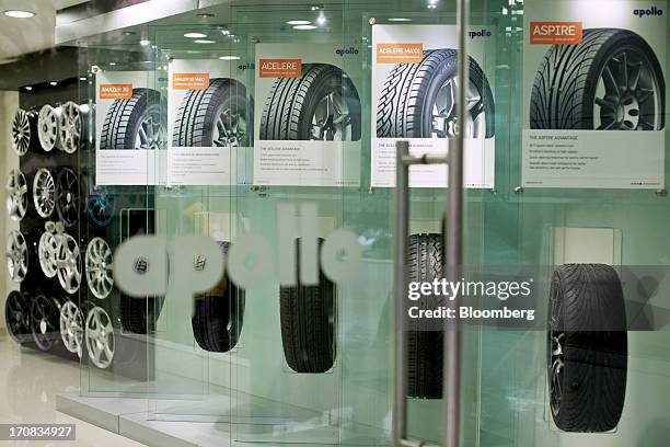 The Apollo Tyres Ltd. Tire range stands on display at the company's Apollo Super Zone retail outlet in Mumbai, India, on Tuesday, June 18, 2013....
