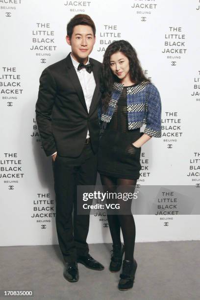 Chen Zhengfei and Zhu Zhu attend the opening of the Chanel: THE LITTLE BLACK JACKET Exhibition at 751 D.Park on June 18, 2013 in Beijing, China.