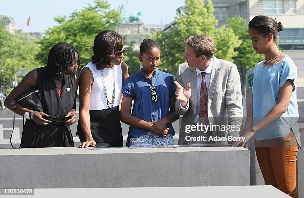 First Lady Michelle Obama visits the Memorial to the Murdered Jews of Europe with her husband's half sister, Auma Obama, her daughter Sasha, Uwe...