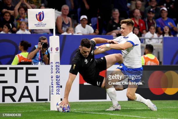 Will Jordan of New Zealand scores his team's first try during the Rugby World Cup France 2023 match between New Zealand and Italy at Parc Olympique...