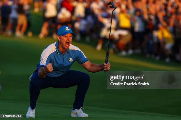 Justin Rose of Team Europe celebrates on the 18th green after making a putt against the United States during the Friday afternoon fourball matches of...