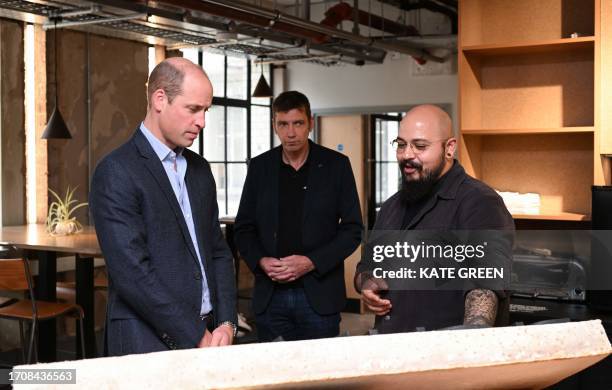 Britain's Prince William, Prince of Wales speaks with business owners during a visit to Sustainable Ventures in London on October 5 Europe's largest...