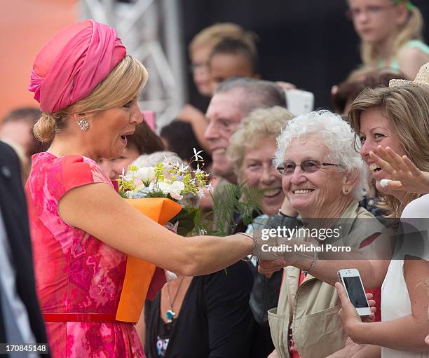 Queen Maxima of The Netherlands meets with members of the multi cultural community during an official visit to downtown Lelystad on June 19, 2013 in...