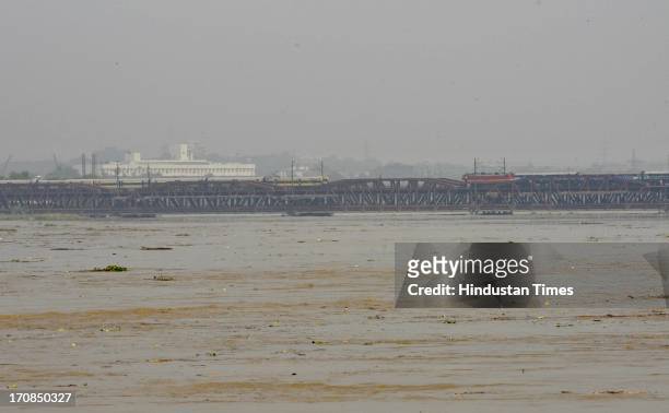 The flooded river Yamuna after heavy monsoon rains on June 19, 2013 in New Delhi, India. Several low-lying areas along the Yamuna were today flooded...