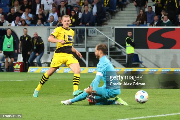 Julian Ryerson of Borussia Dortmund scores his teams third goal past Goalkeeper, Oliver Baumann of TSG Hoffenheim during the Bundesliga match between...