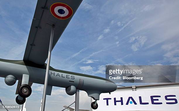 Logo sits on the fuselage of a Thales SA unmanned air vehicle or drone, outside the company's stand on the second day of the Paris Air Show in Paris,...