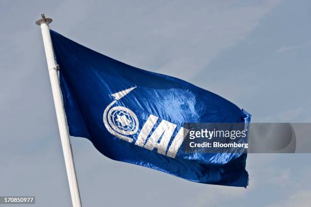 Logo sits on a flag as it flies above Israel Aerospace Industries Ltd.'s display stand on the second day of the Paris Air Show in Paris, France, on...