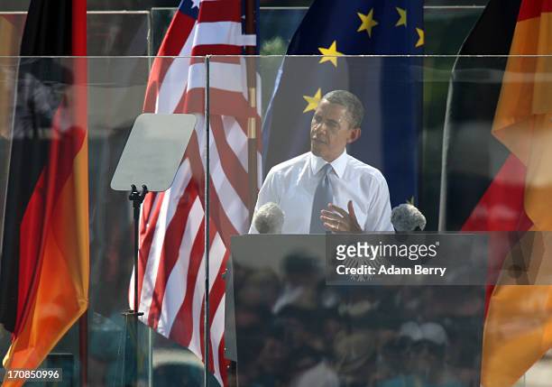 President Barack Obama speaks behind bulletproof glass at the Brandenburg Gate on June 19, 2013 in Berlin, Germany. Obama is visiting Berlin for the...